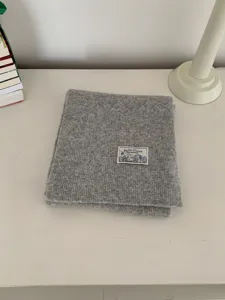 Minimalist solid gray knit scarf for women, cozy winter warm neck wrap, casual daily accessory.