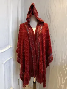 Red hooded knitted shawl for women, featuring fringe hem, ethnic style texture and cozy wear.