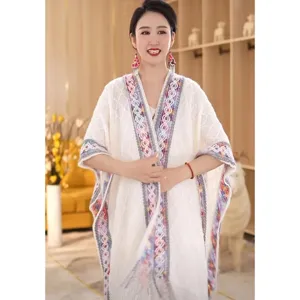 Women ethnic knit shawl cardigan with colorful woven trim, casual comfortable outerwear.