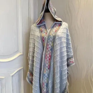 Women's hooded knitted poncho shawl, stylish ethnic pattern checkered design, versatile warm winter wrap.