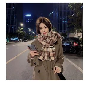 Detailed view of women's cozy imitation cashmere plaid scarf, winter warm colorblock design.