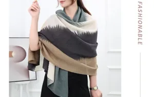 Detailed view of the soft pleated gradient scarf, showcasing exquisite fabric texture and drape.