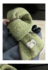 Green yellow textured knitted scarf cozy winter neck warmer detail view soft stylish accessory