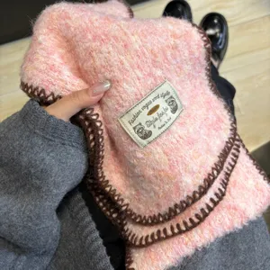 Cozy pink gradient fluffy knitted scarf winter warm neck wrap detail showcasing soft texture