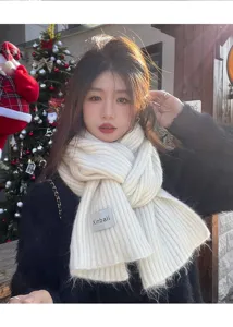 Cozy wool-blend winter knitted scarf for women, warm and soft white neck wrap accessory.