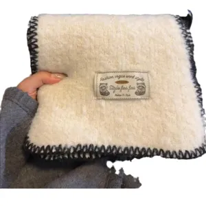 White plush winter scarf for women, warm knitted neck warmer and stylish outer shawl for cold days.