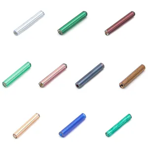 Detailed shot of colorful glass bugle beads, 12mm long tube spacer beads for DIY jewelry making.