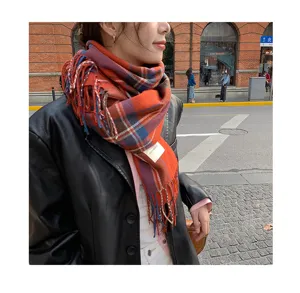 Cozy winter plaid scarf for women featuring retro fringe design and soft warm fabric.