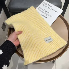 Cozy soft winter knitted wool scarf for women and men, warm solid color neck warmer detail.