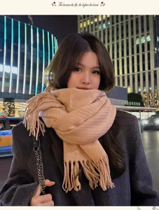 Cozy winter thick tassel scarf detail shot, warm knitted texture for cold weather styling.