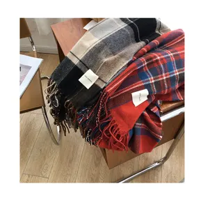 Detailed view of winter retro plaid fringe scarves with classic checkered patterns and soft texture.