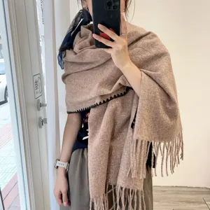 Cozy winter scarf with fringe detail, thick warm knitted shawl for women daily wear.