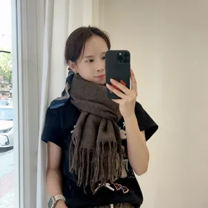 Thickened brown winter scarf for women, warm cozy tassel design, stylish daily casual wear.