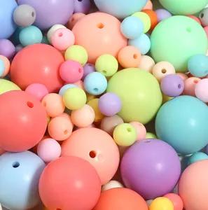Close-up detail shot of colorful round DIY beads, multi-size pastel acrylic spacer bead.