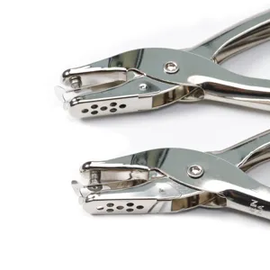 Close-up detail shot of professional silver metal handheld hole puncher, durable office tool.