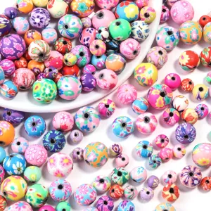 Perles en argile polymère colorées imprimées rondes fleuries pour fabrication de bracelets bijoux DIY.