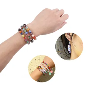 DIY handmade glass bead bracelets and earrings detail view showing colorful assorted beads.
