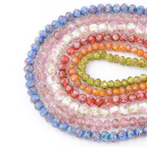 Colorful faceted millefiori glass beads with gold sand floral design for DIY jewelry making.