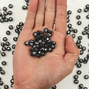 Acrylic flat round alphabet letter beads with black and white design for DIY jewelry crafts.