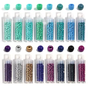 Close-up detail view of assorted colorful glass seed beads neatly packed in clear plastic tubes.