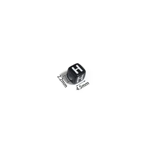 Acrylic square letter bead detail, black background with white letter H, DIY loose craft bead.