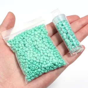 Light green glass seed beads, bottled and bag packaging for DIY jewelry accessories.