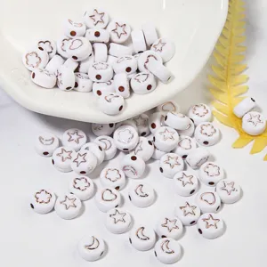 Acrylic flat round beads with rose gold star moon flower charms for DIY jewelry making.