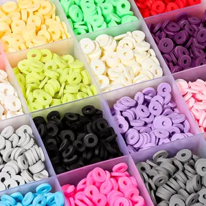 Close-up of colorful polymer clay beads in grid box, perfect for DIY handmade bracelets and necklaces.