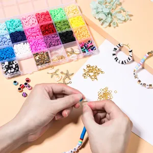 Detailed view of 24-grid polymer clay beads kit with letter charms for handmade jewelry.