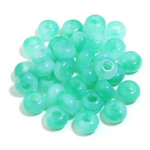 Green acrylic loose beads detail shot, perfect for DIY bracelets and jewelry making craft supplies.