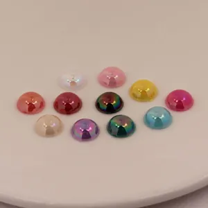 Close-up of colorful acrylic dome cabochons, flatback rhinestones for DIY crafts and jewelry.