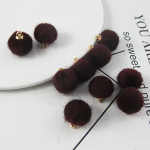 Burgundy fluffy pom pom charms with gold loops, ideal for DIY handmade earrings and jewelry making.