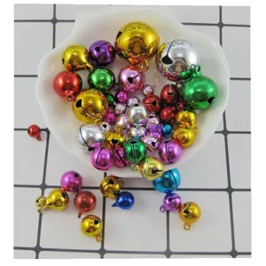 Colorful DIY metal jingle bells in assorted shiny colors for crafts, bracelets and pet accessories.