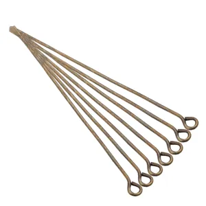 Detail view of bronze eye head pins, essential DIY jewelry making and beading connectors.