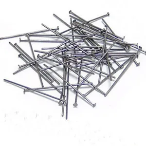Detail view of metal T-pins and flat head pins for DIY jewelry making and craft projects.