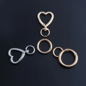 Alloy heart shaped lobster clasp and round spring rings for DIY bag keychains detail view.