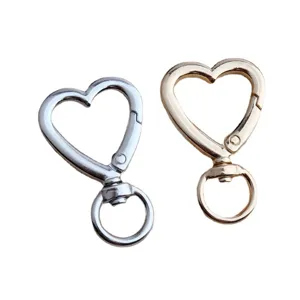 Heart-shaped metal snap hook keychains, gold and silver alloy spring clips for DIY bags and keys.
