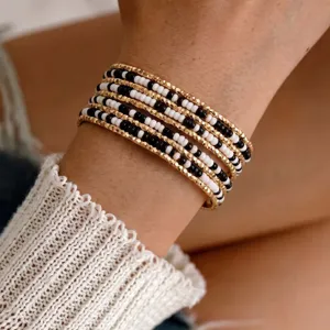 Meerlaagse rocailles armbanden met gouden metalen Spacers en zwart witte kralen sieraden