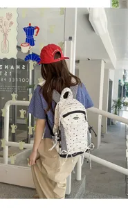 Japans stijl rugzak met polkadots, ruitjespanelen en leuke strikdetails.