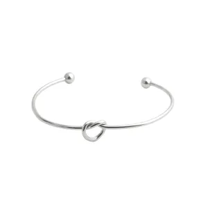 Brazalete abierto de nudo de acero de titanio minimalista para mujer, joya elegante.