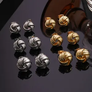 Pendientes de botón geométricos de metal torcido dorado y plateado, joyería elegante para mujer.