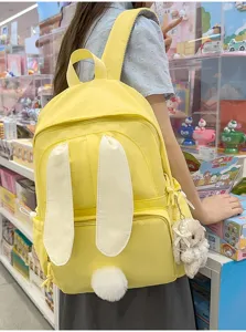 Schattige konijnenoren rugzak voor meisjes, gele schooltas met pluizige staart en hanger.