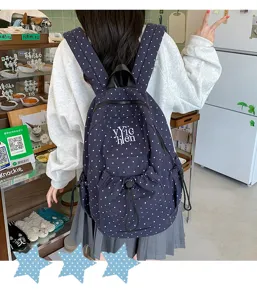 Navy blue polka dot canvas backpack for women, casual school bookbag with drawstring and zipper.