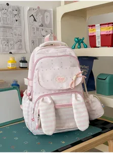 Leuke roze konijnenoor rugzak met sterrenpatroon en strepen voor schoolmeisjes.