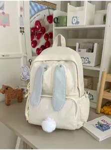 Leuke crèmekleurige canvas rugzak met lichtblauwe konijnenoren en pluizige staart voor studenten.