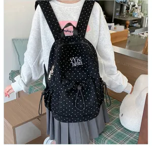 Casual black polka dot backpack with drawstring and zipper pockets, stylish daily daypack.