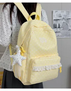 Detailed shot of Japanese style yellow star print backpack with cute lace trim and star pendant.
