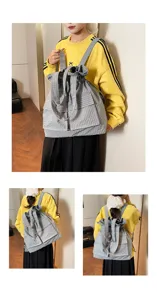 Detailed view of grey plaid Oxford fabric drawstring backpack with front pockets and straps.