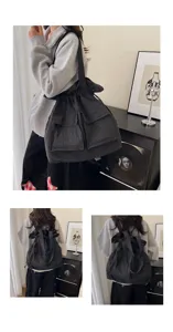 Detailed view of the dark grey plaid tactical backpack, casual drawstring two-way shoulder bag.