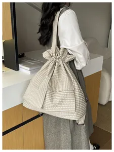 Fashionable plaid drawstring backpack utility style casual dual use shoulder bag for travel daily